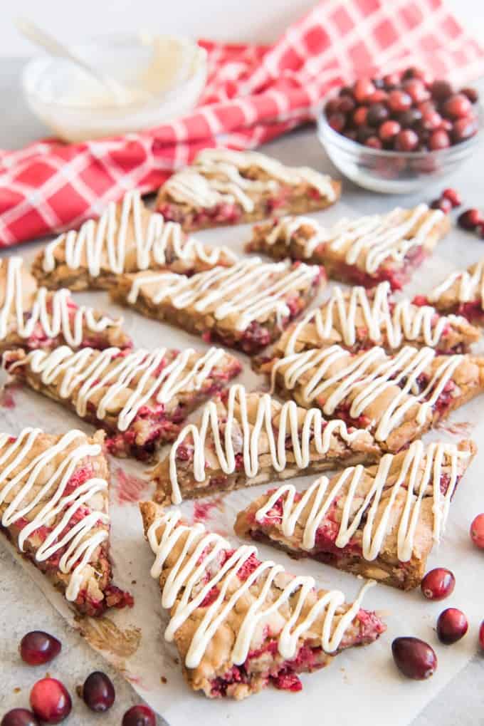 sliced white chocolate cranberry blondies with drizzled icing on top