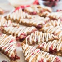 white chocolate drizzled on triangle cut cranberry blondies