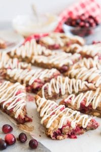 white chocolate drizzled on triangle cut cranberry blondies