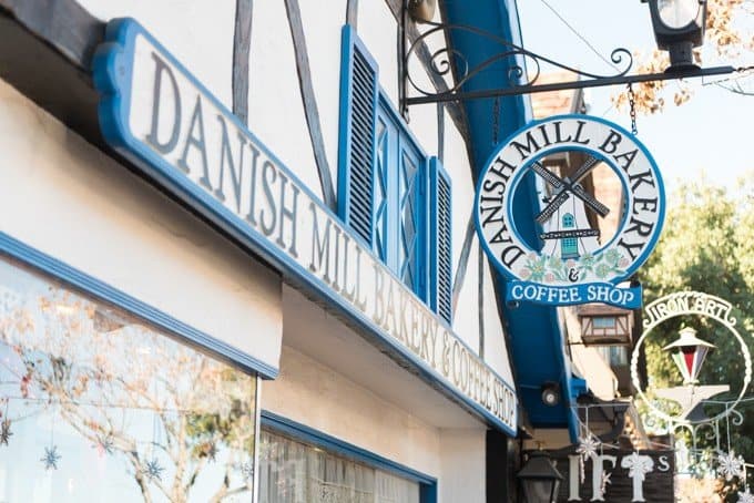Sign for Danish Mill Bakery & Coffee Shop in Solvang, CA.