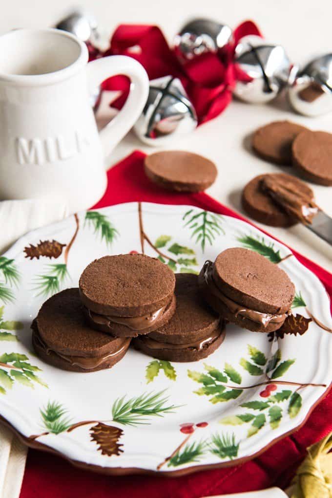 nutella sandwich cookies on a plate and off of a plate with spread