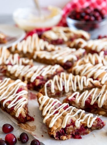 White chocolate cranberry blondies cut into triangles.