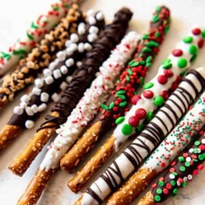 Chocolate covered pretzels decorated differently and festively.