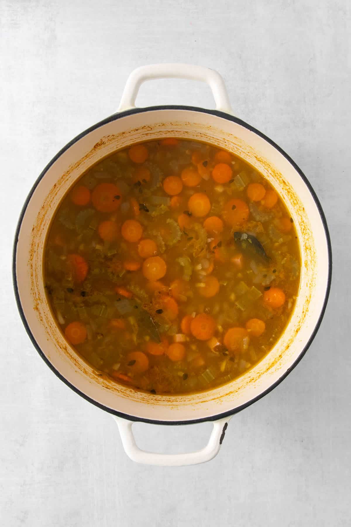 Simmered split pea soup ingredients in a pot.
