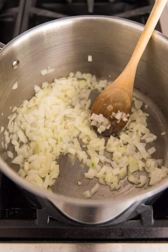 Sauteed onions in a large pot.