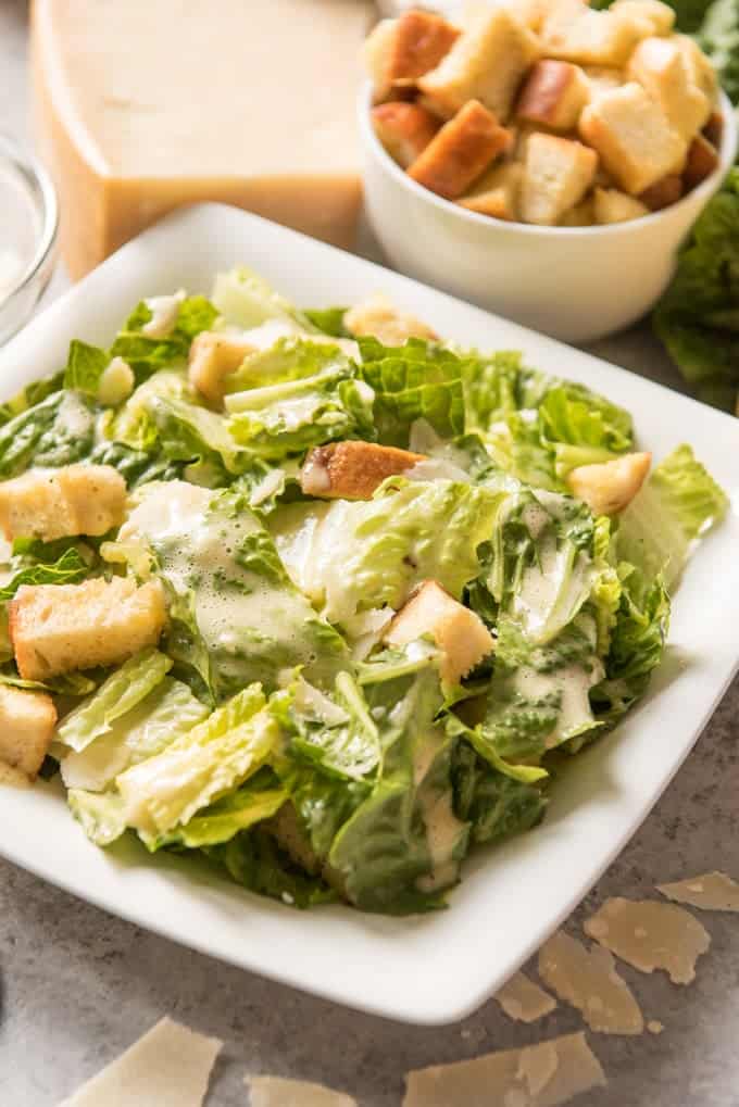 An image of a classic caesar salad made with homemade caesar salad dressing and homemade croutons.