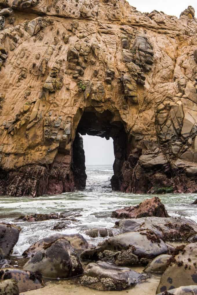 An image of Keyhole Arch in Big Sur at Pfeiffer Beach is a fun thing to do in Big Sur.