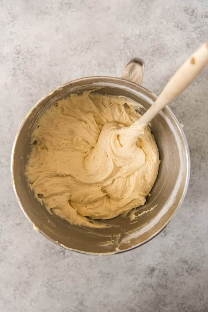 An image of a large bowl of coffee cake batter made with sour cream mixed up in a mixing bowl