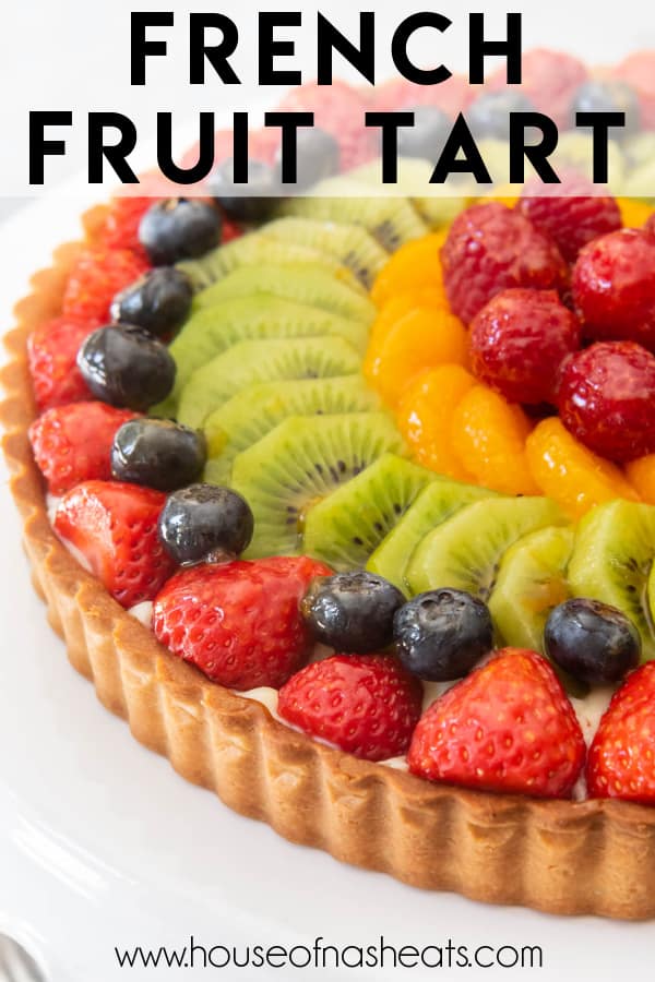 A french fruit tart on a white plate with text overlay.