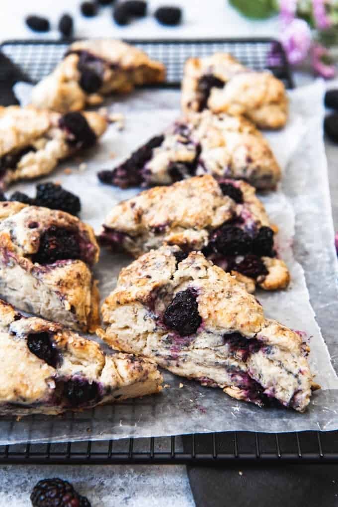 blackberry scones on wax paper on a wire rack