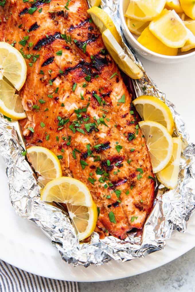 Grilling this Soy Brown Sugar Salmon in Foil makes for an easy weeknight dinner that is impressive enough to serve as weekend fare for guests.Â  The salmon is first marinated in a simple marinade, the sealed in foil and grilled (or baked!) for about 15 minutes just until it flakes apart!