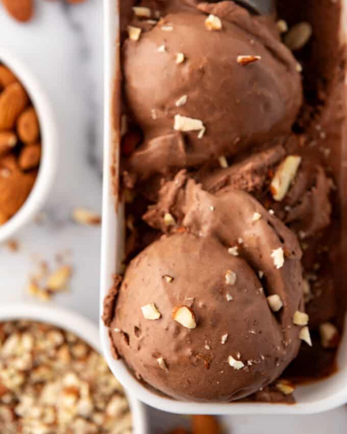 A close up image of scoops of burnt almond fudge ice cream.