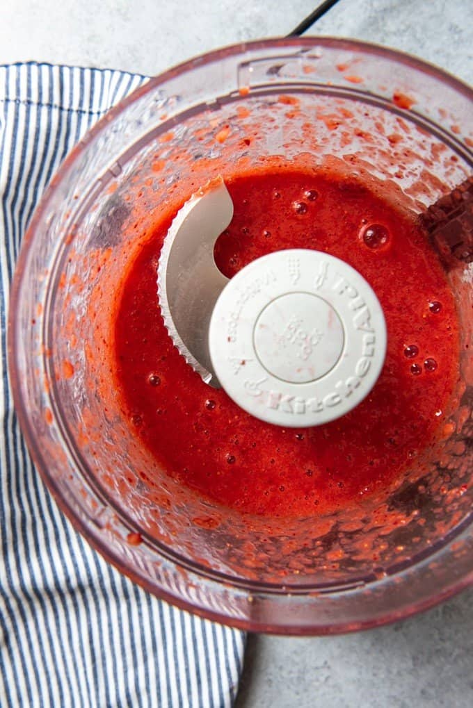 An image of strawberry puree used for making a fresh strawberry glaze for homemade strawberry pie.