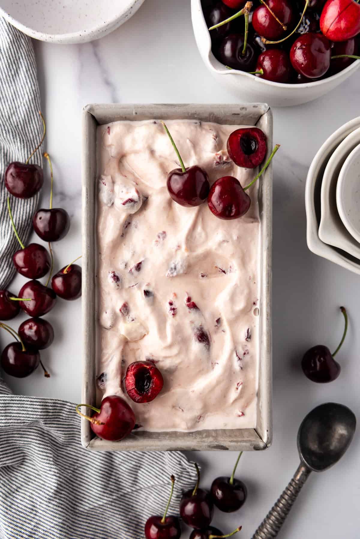 An image of black cherry ice cream in a loaf pan.