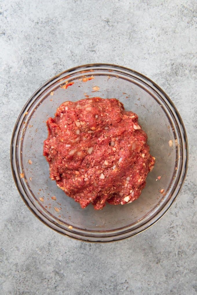 An image of meatloaf mixture ready to be shaped into mini loaves.
