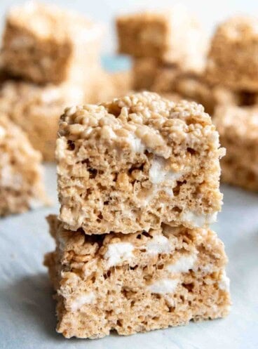 An image of gooey rice krispie treats stacked on top of each other.