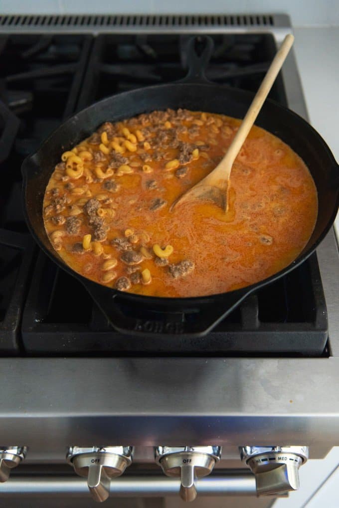 An image of hamburger helper cooking on the stovetop.