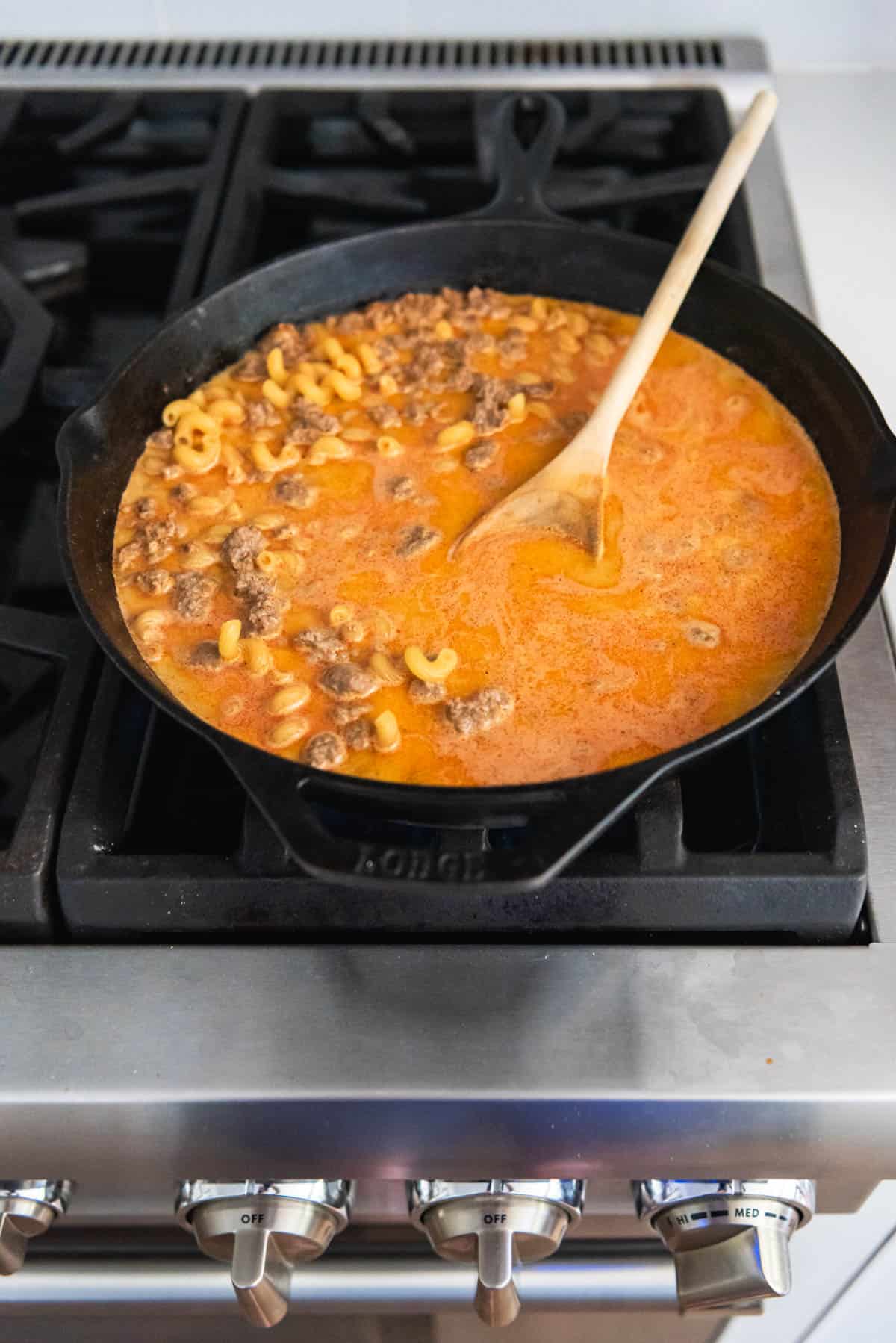 An image of hamburger helper cooking on the stovetop.