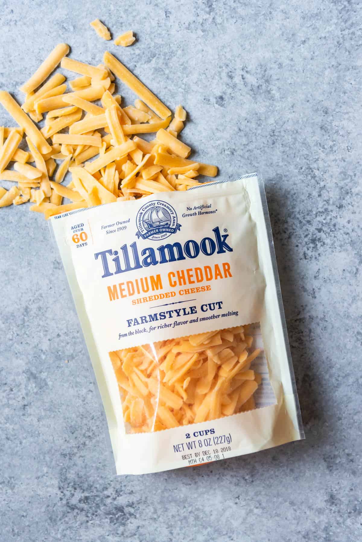 An image of Tillamook farmstyle cut cheddar cheese.