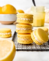 An image of lemon macarons stacked on top of each other.