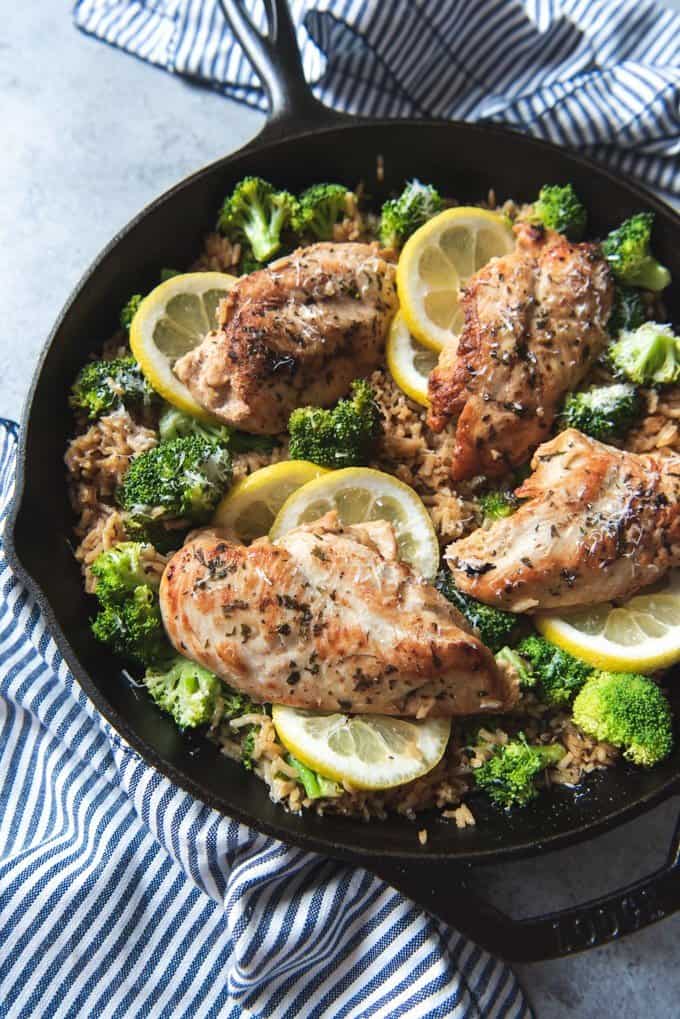 An image of a lemon chicken & rice skillet meal made in one pot with broccoli and Parmesan cheese for an easy weeknight dinner recipe.