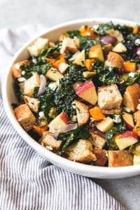 a white bowl filled with Fall Panzanella Salad