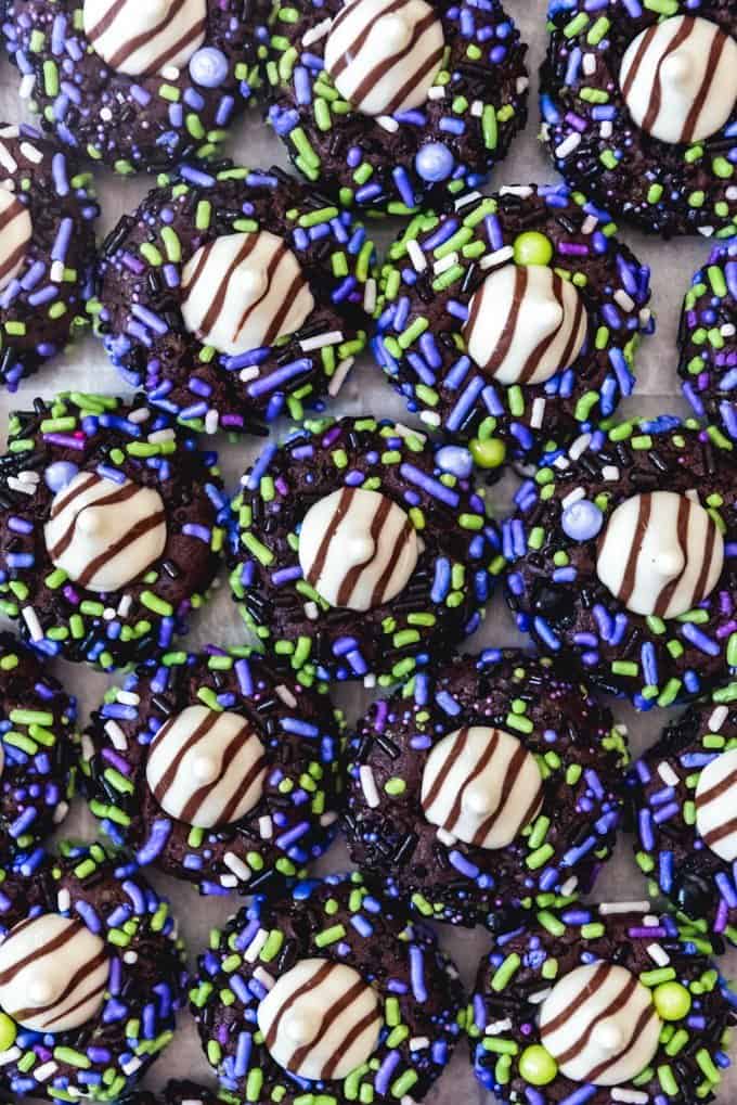 An image of chocolate sprinkle cookies with Hershey's Hugs candy pressed into the centers.