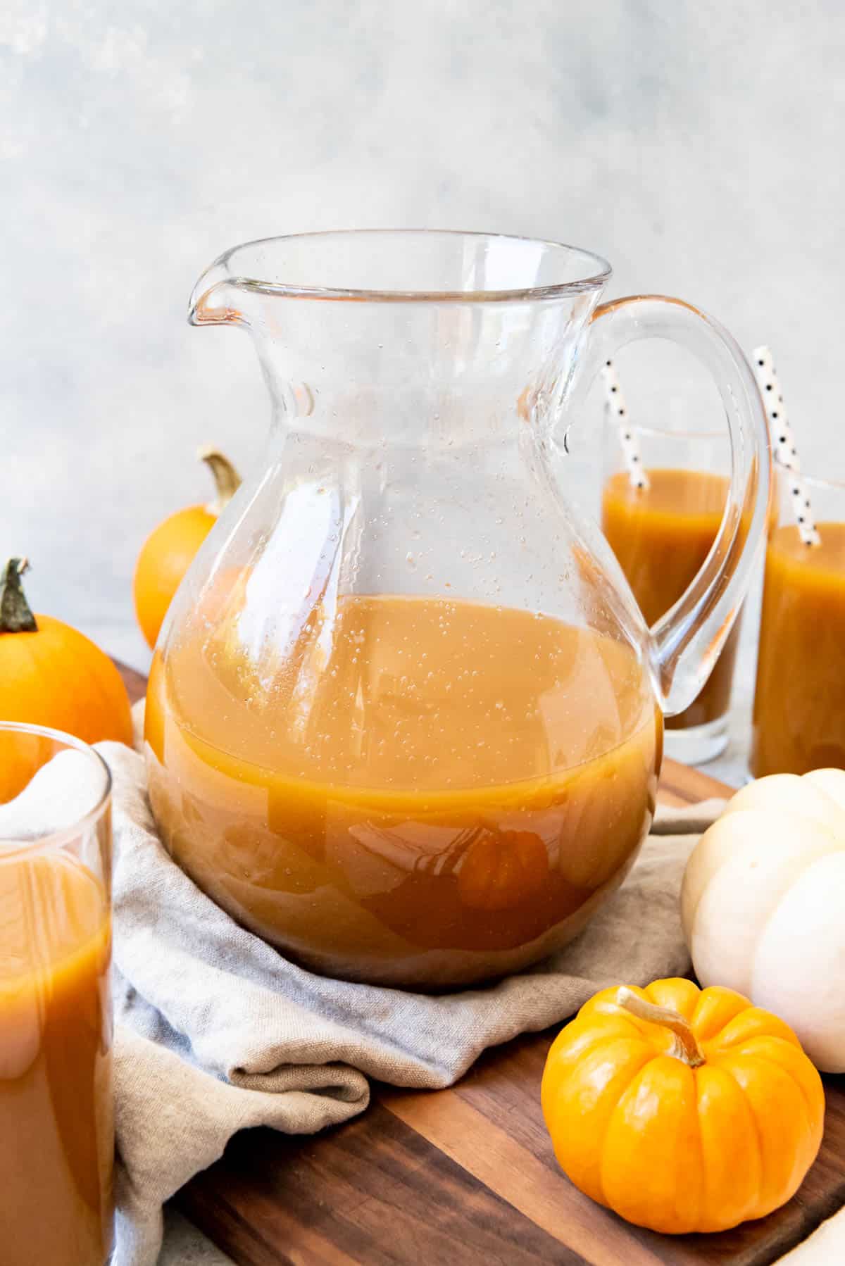 A pitcher of homemade pumpkin juice inspired by the Harry Potter books is perfect for Halloween, Thanksgiving, and Fall parties.