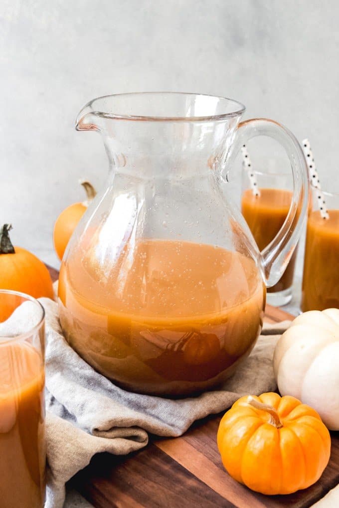 A pitcher of homemade pumpkin juice inspired by the Harry Potter books is perfect for Halloween, Thanksgiving, and Fall parties.