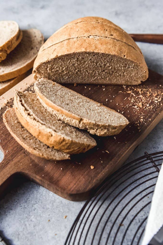 An image of a sliced loaf of sliced rye bread with caraway seeds and part wheat flour for a soft, fluffy loaf.