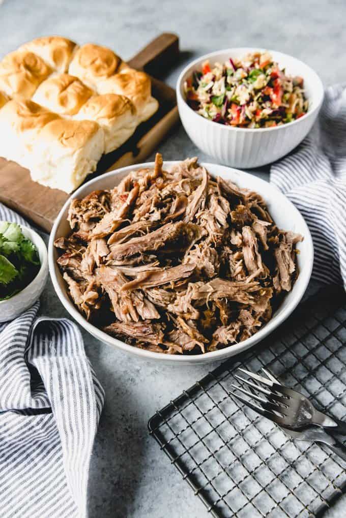 An image of a bowl of shredded Asian pulled pork for sandwiches, sliders, nachos, tacos, burritos, or just served plain over rice.