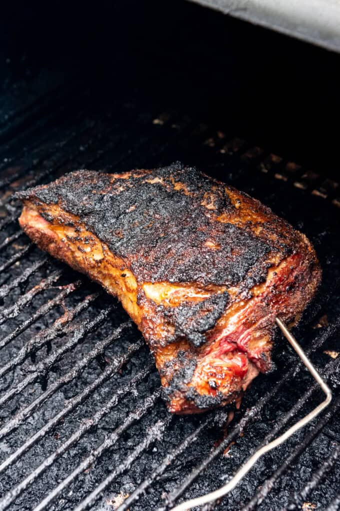 An image of a grilled Santa Maria Tri-Tip on the grill with an instant read meat thermometer inserted into it..