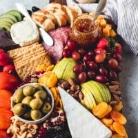 a fruit and cheese platter with a ton of options