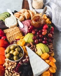 a fruit and cheese platter with a ton of options