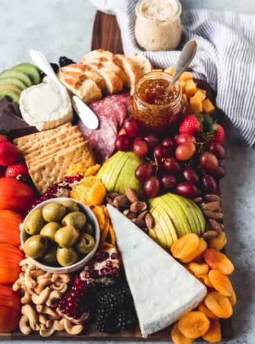 a fruit and cheese platter with a ton of options