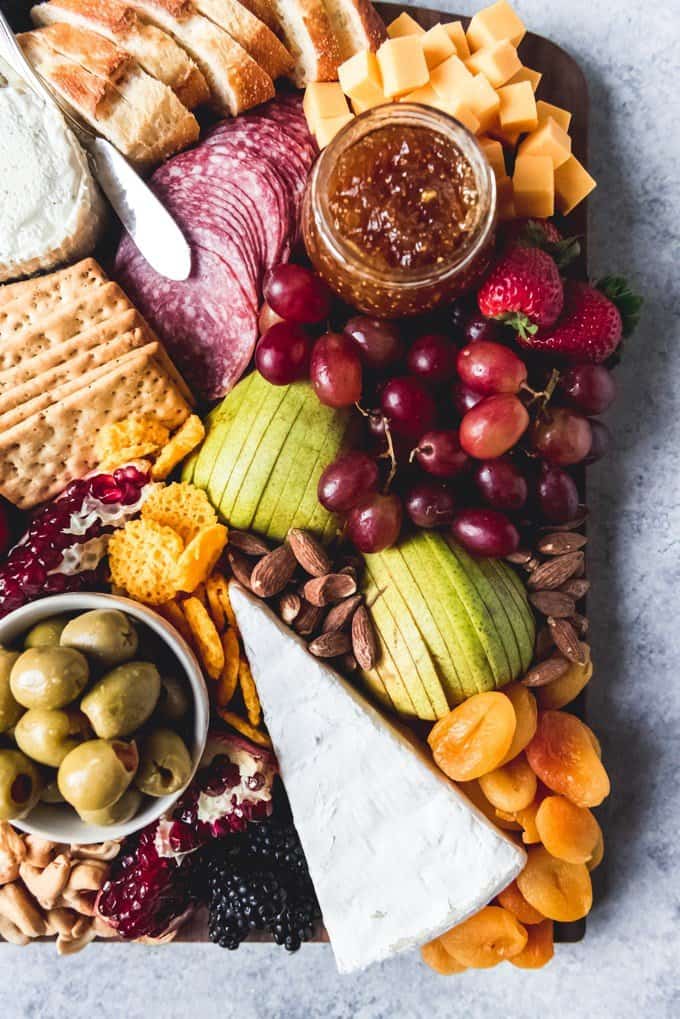 An image of the best fruit and cheese board for an easy appetizer for a Christmas party.