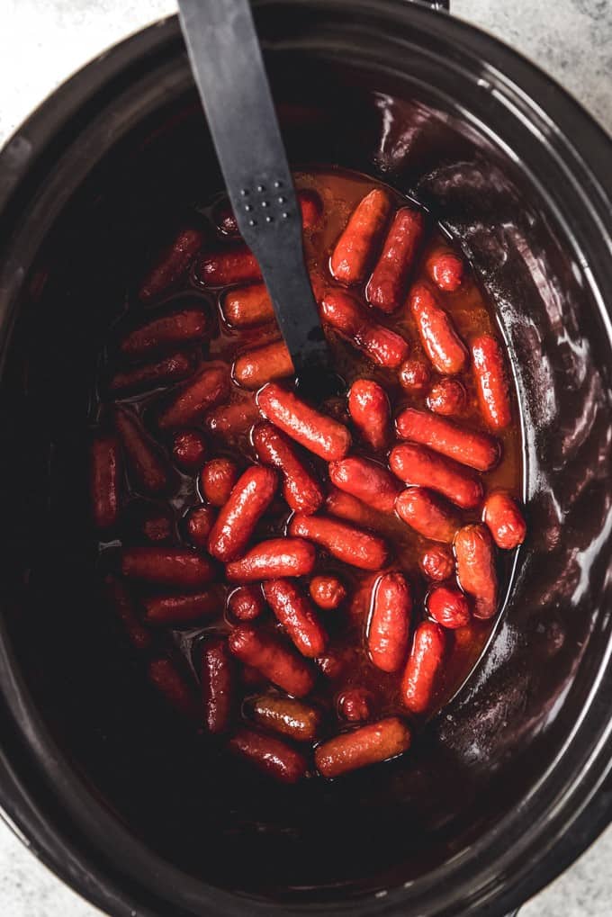 An image of crockpot bbq little smokies for an easy game day appetizer.