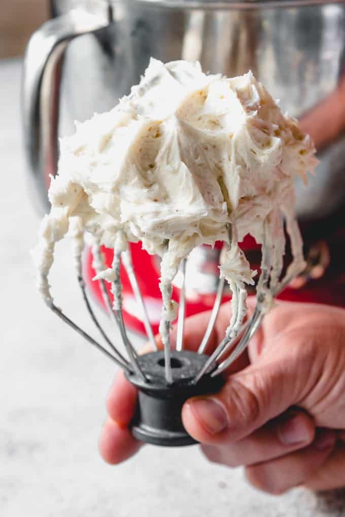a stand mixer beater covered in eggnog buttercream
