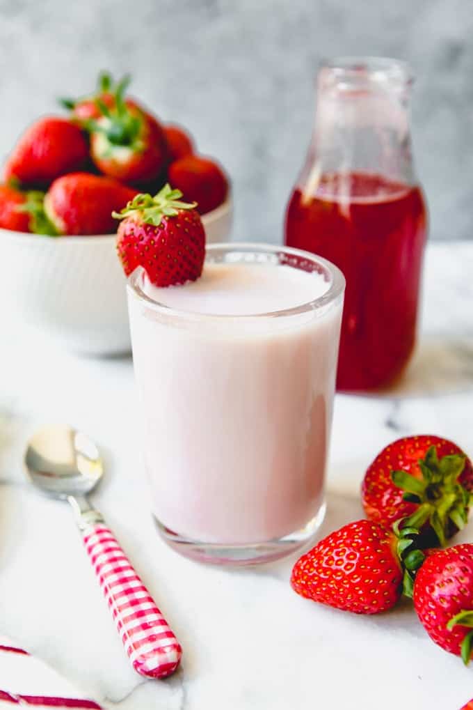 Forget store-bought strawberry syrup and make this from scratch, homemade Strawberry Milk with juicy fresh strawberries and no artificial colors, flavors, or dyes!