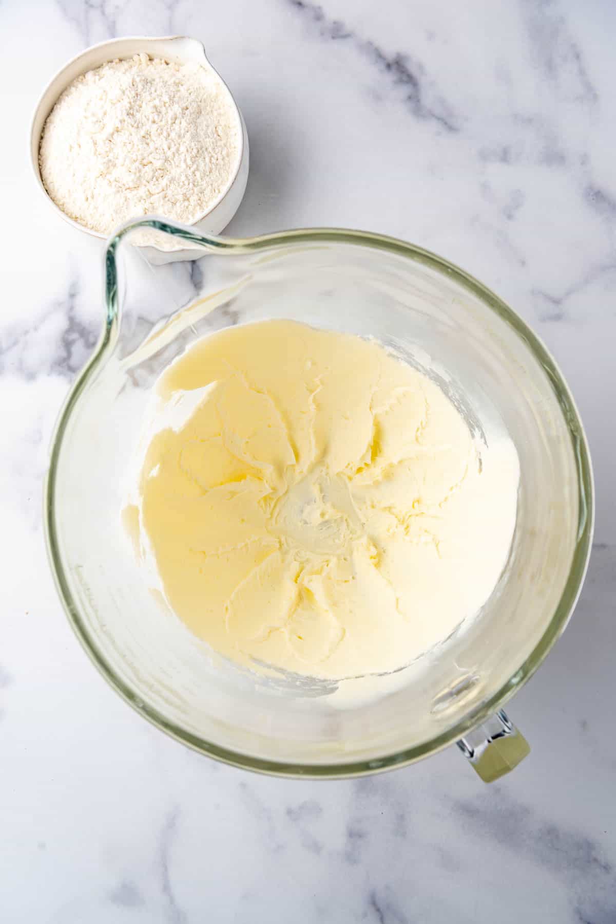 Creamed butter and powdered sugar in a large mixing bowl.