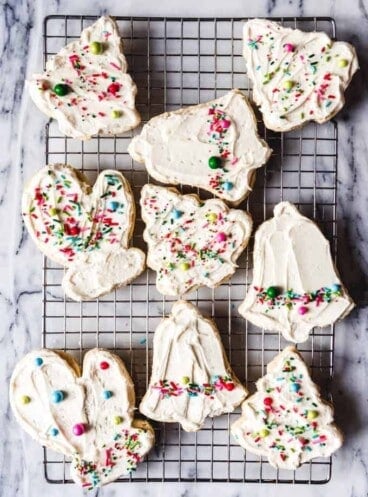 frosted christmas cookies on a wire rack