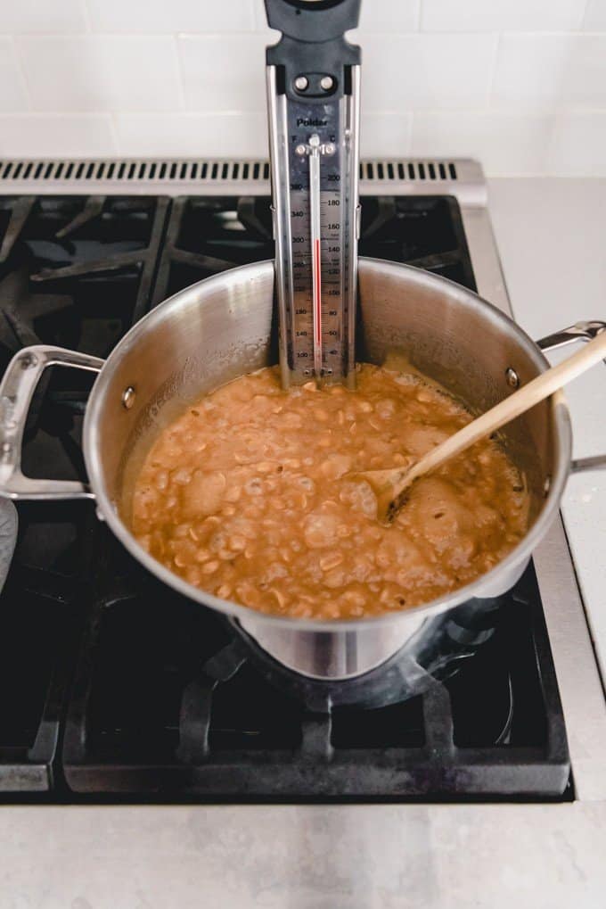 An image of a pot of boiling peanut brittle at 300 degrees F in a step-by-step peanut brittle recipe.