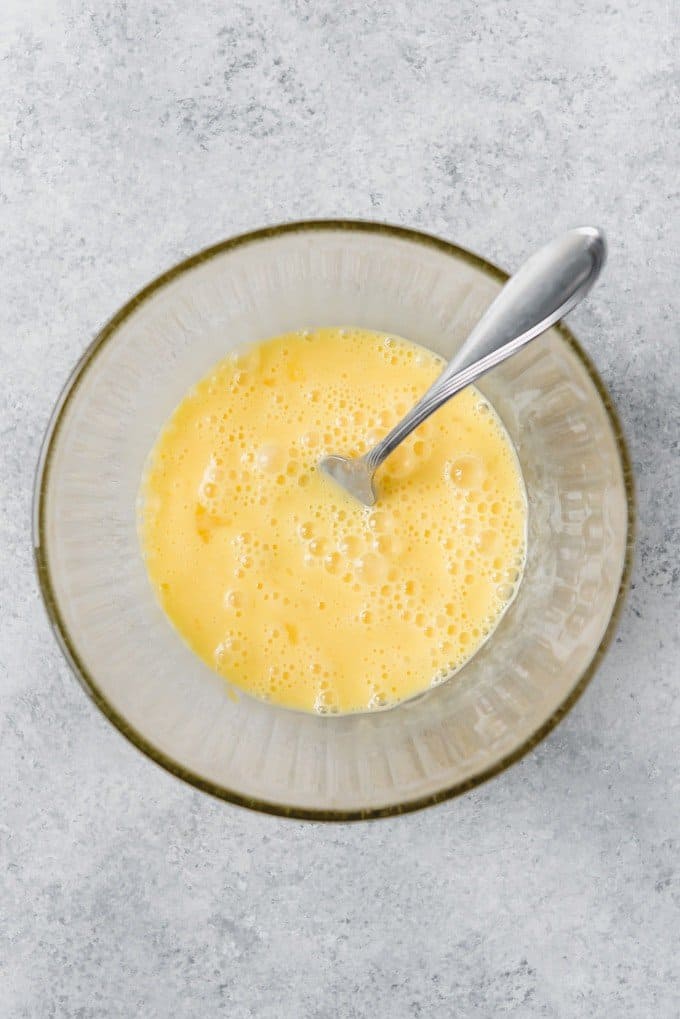 An image of frothy beaten eggs for making light and fluffy scrambled eggs.
