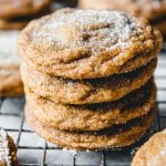 stacked molasses cookies on a wire rack