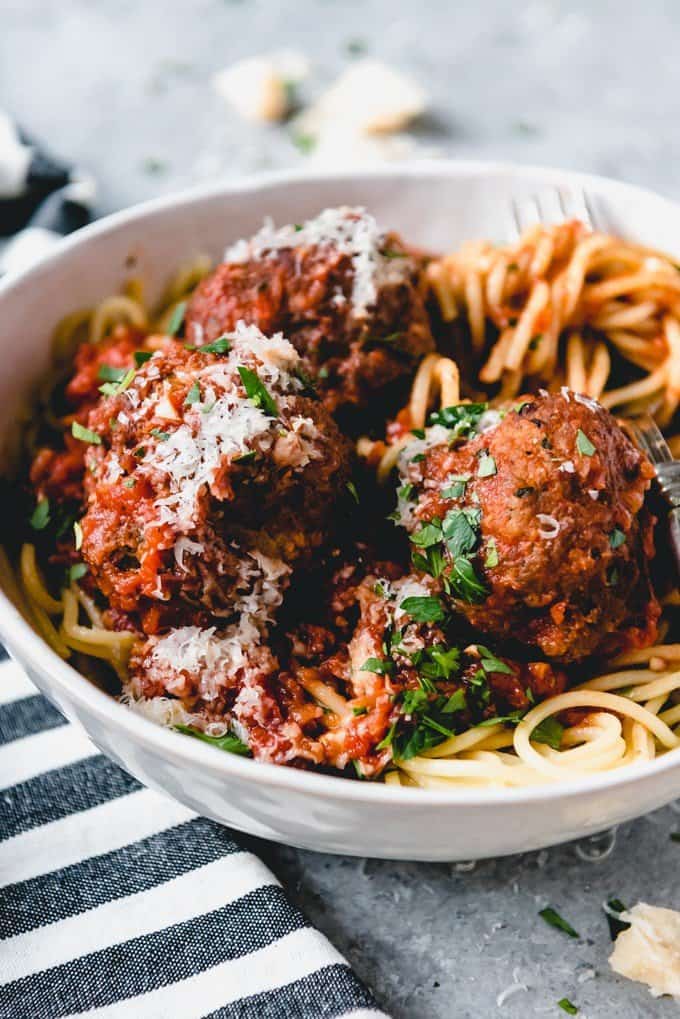 An image of a bowl of homemade spaghetti and Italian meatballs in a rich, homemade spaghetti sauce.