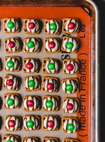 Prepared Christmas hugs on a silicone lined baking sheet.