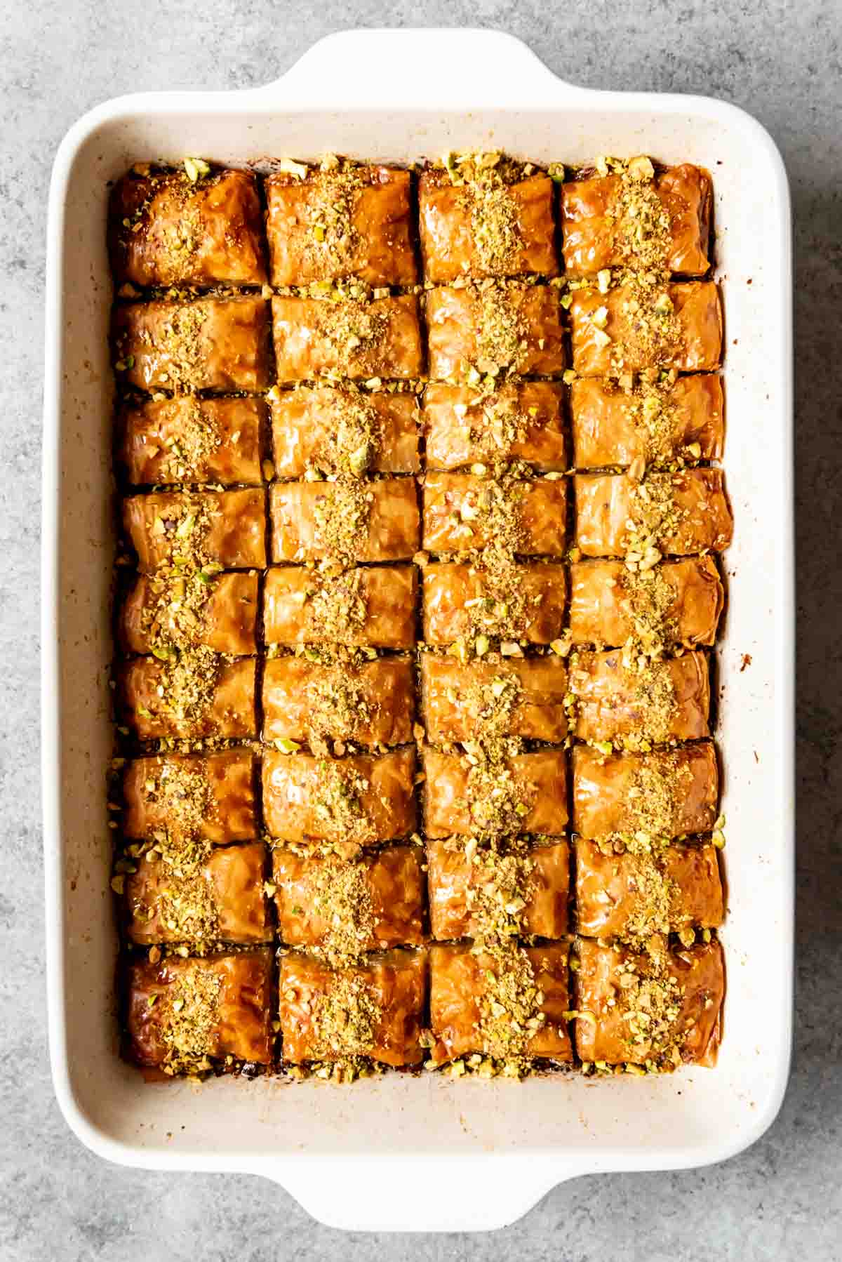 Finely chopped pistachios sprinkled over turkish baklava.