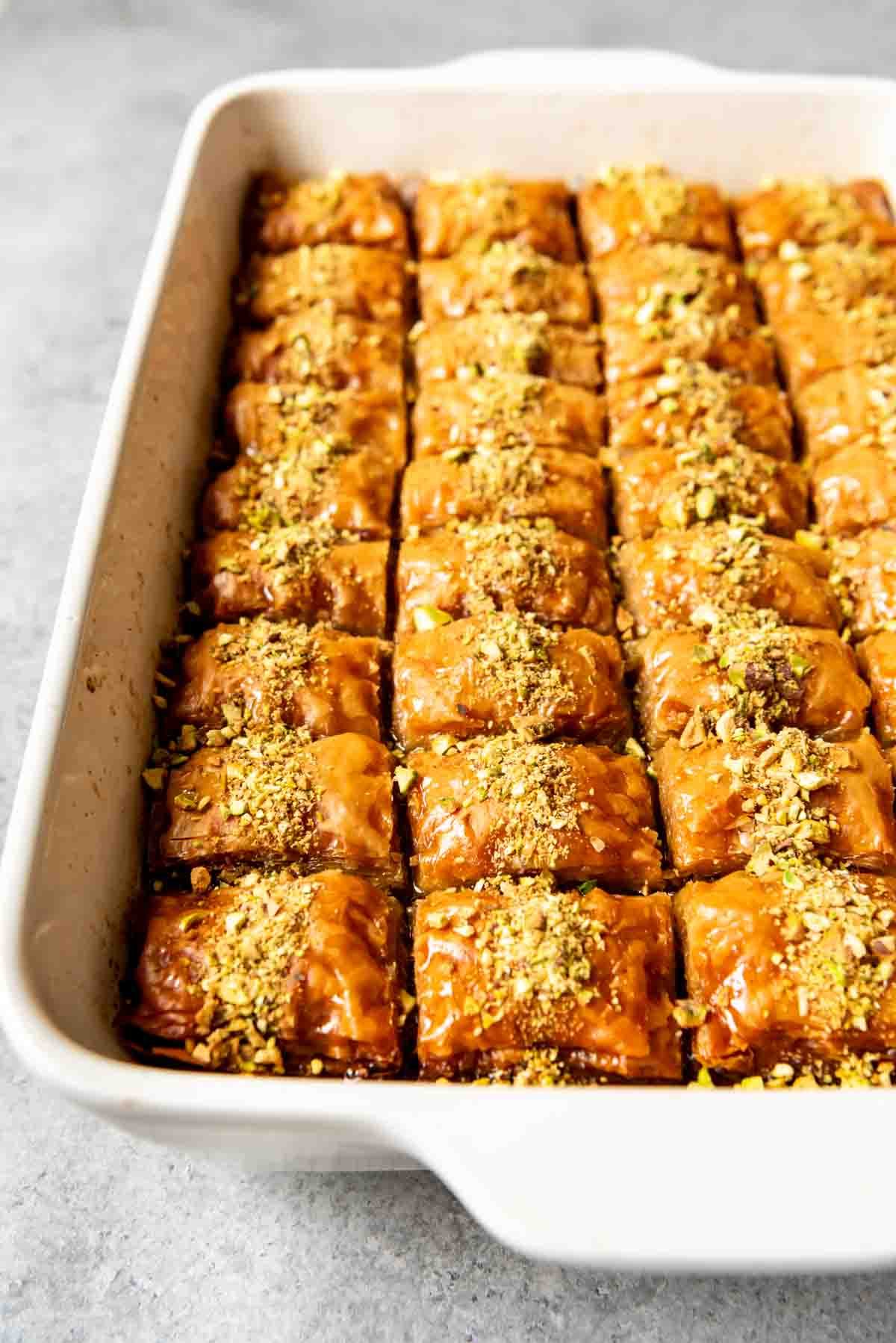 An image of a pan full of authentic Turkish baklava made with pistachios and no honey.