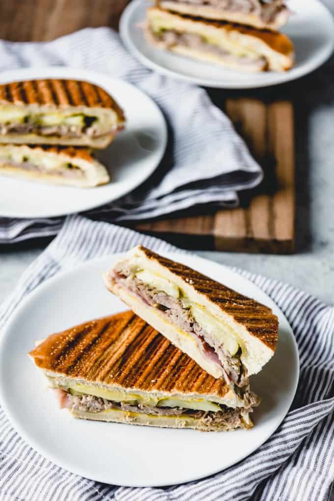 stacked Cuban Sandwiches on plates