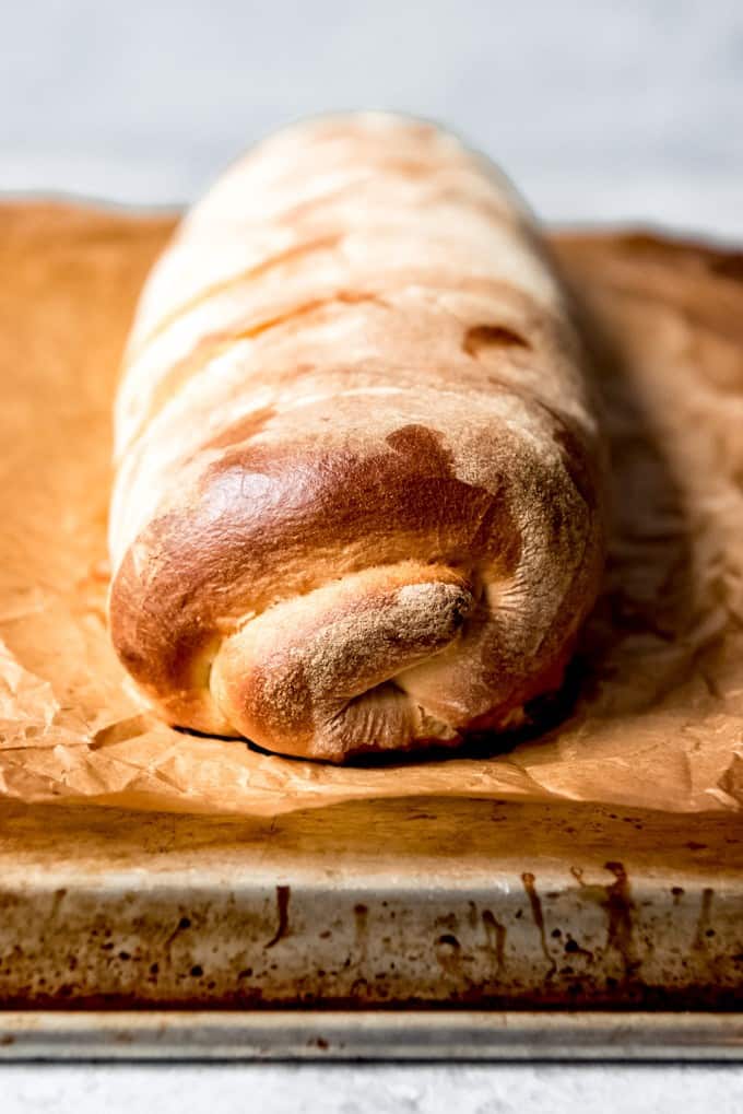 rolled and baked stromboli on parchment paper